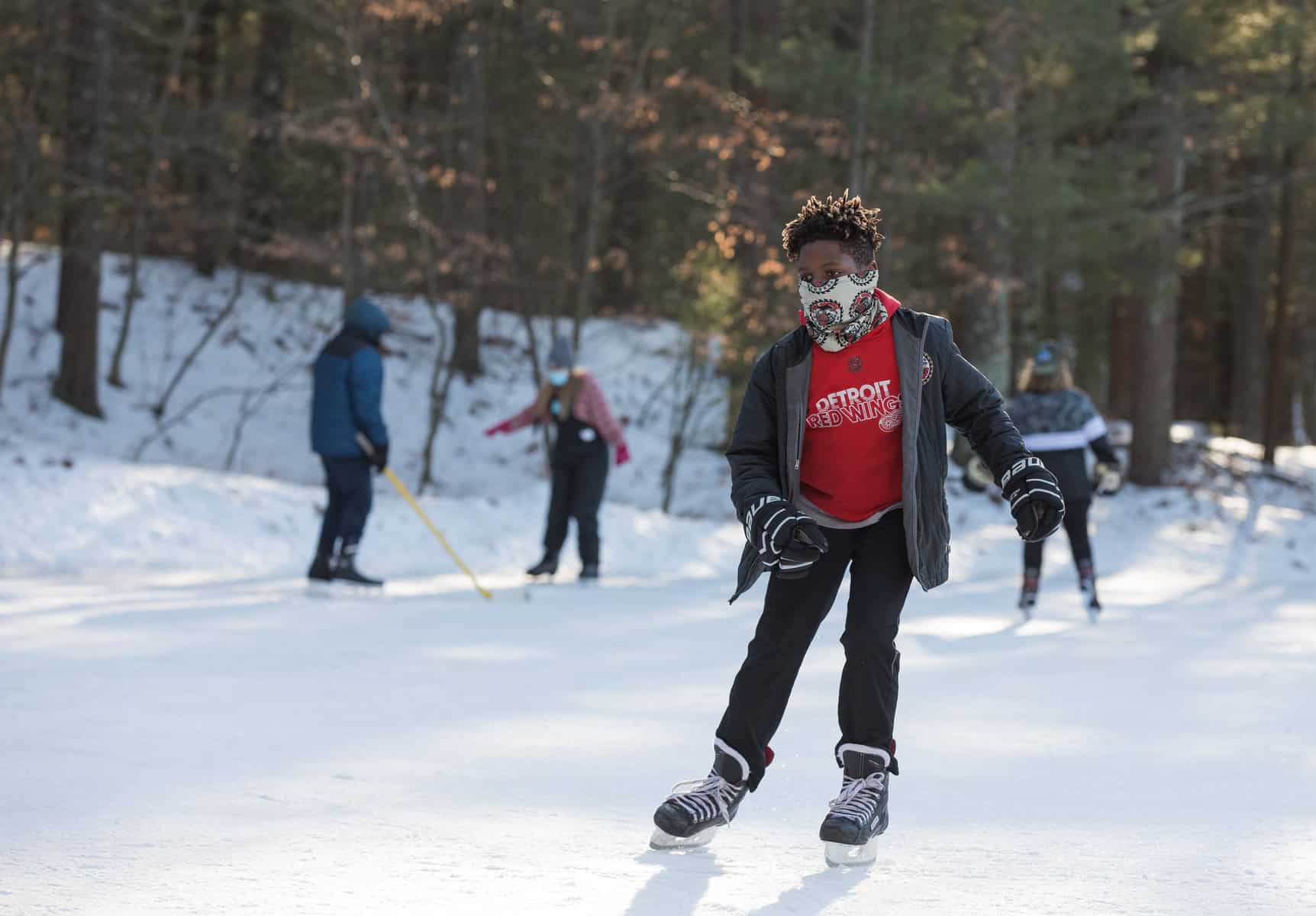 boy ice skating outdoors