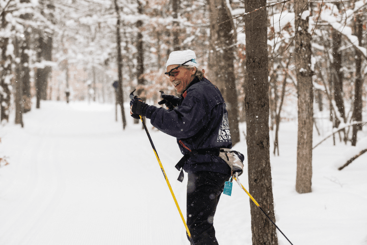 Individual man skiing with winter season pass