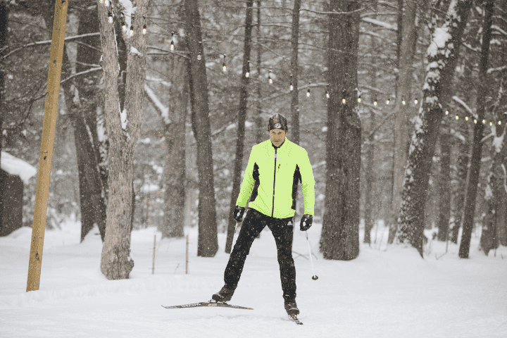 man skate skiing on ski trail with season pass