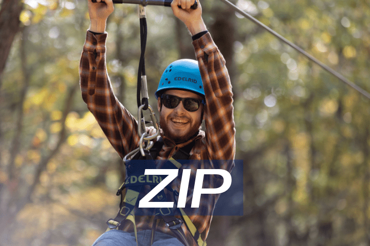 male with sunglasses on summer zip line adventure