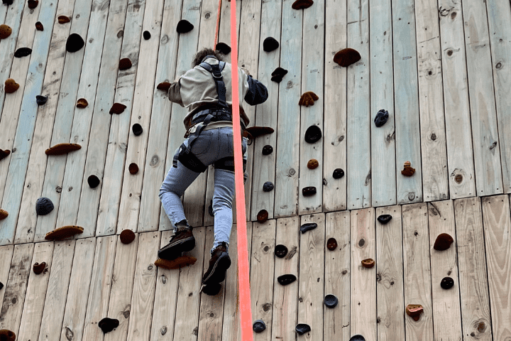 lady climbing outdoor climbing wall
